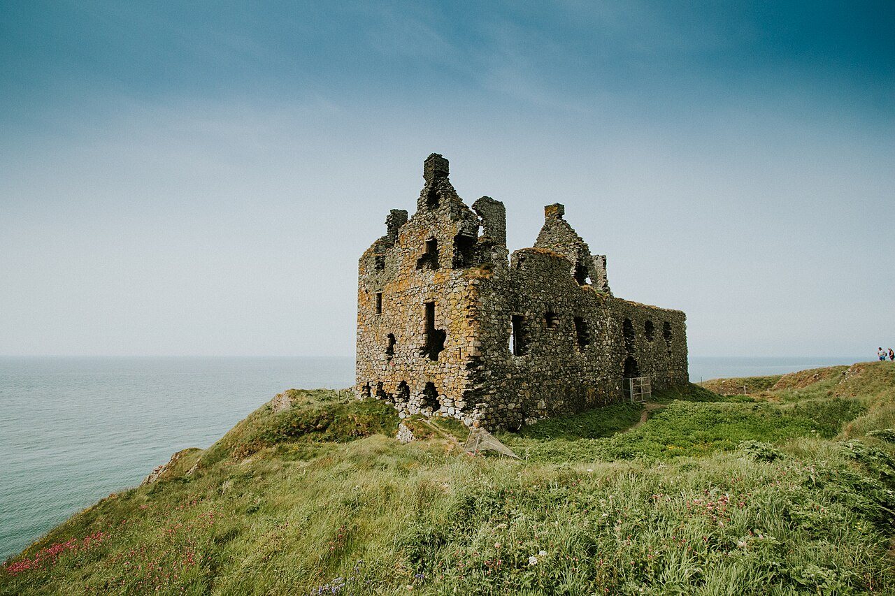 Dunskey Castle on its coastal promontory.